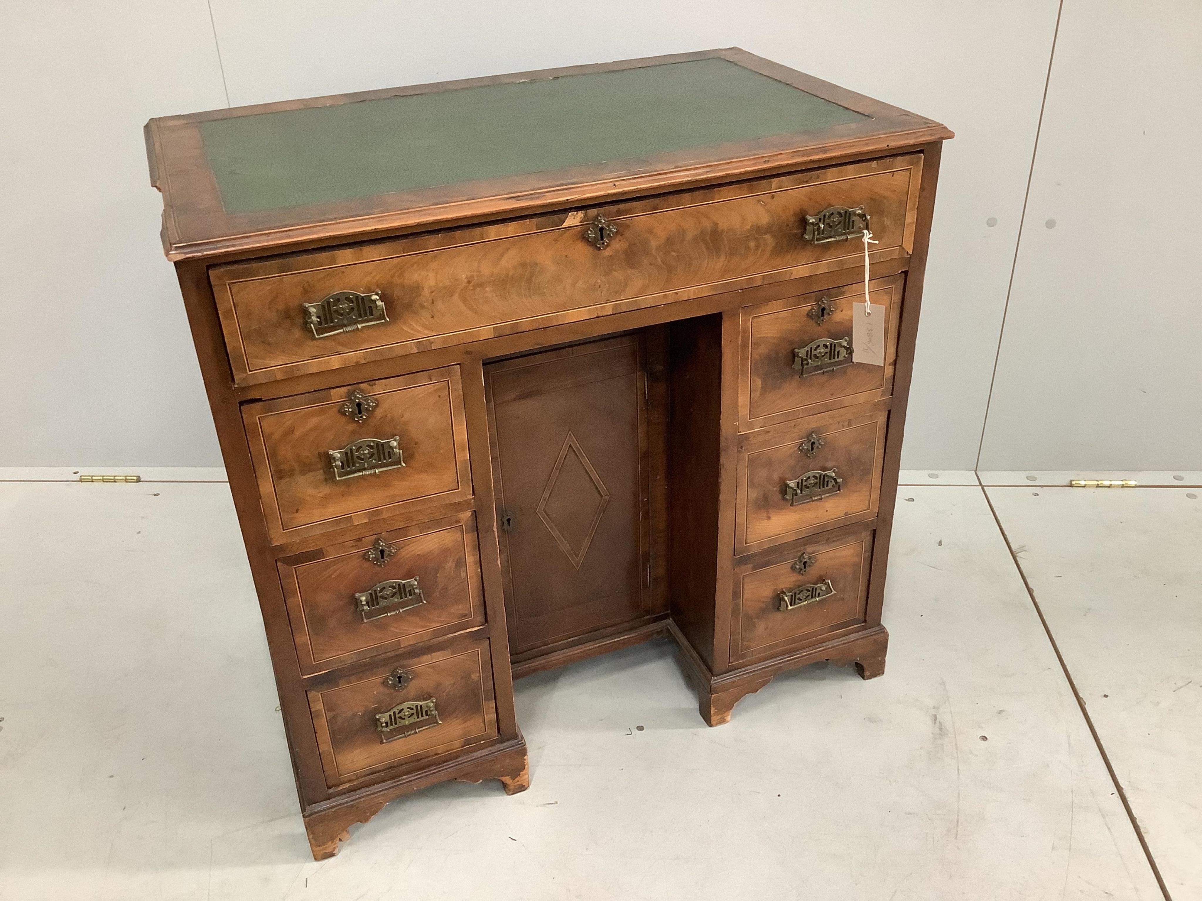 An 18th century and later inlaid walnut kneehole desk, width 77cm, depth 46cm, height 75cm